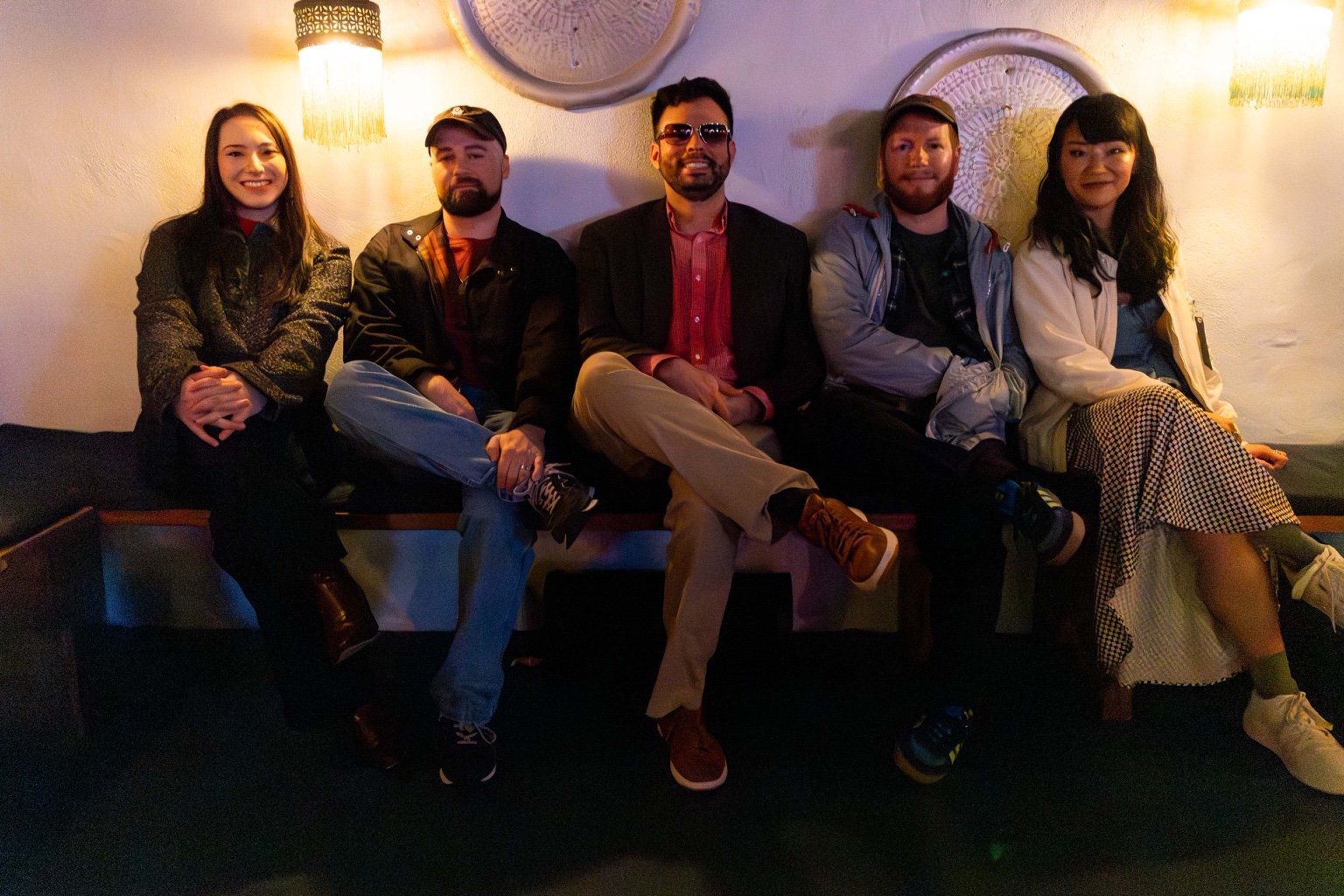 The five members of Good Time Mystery Vision together in a New York bar