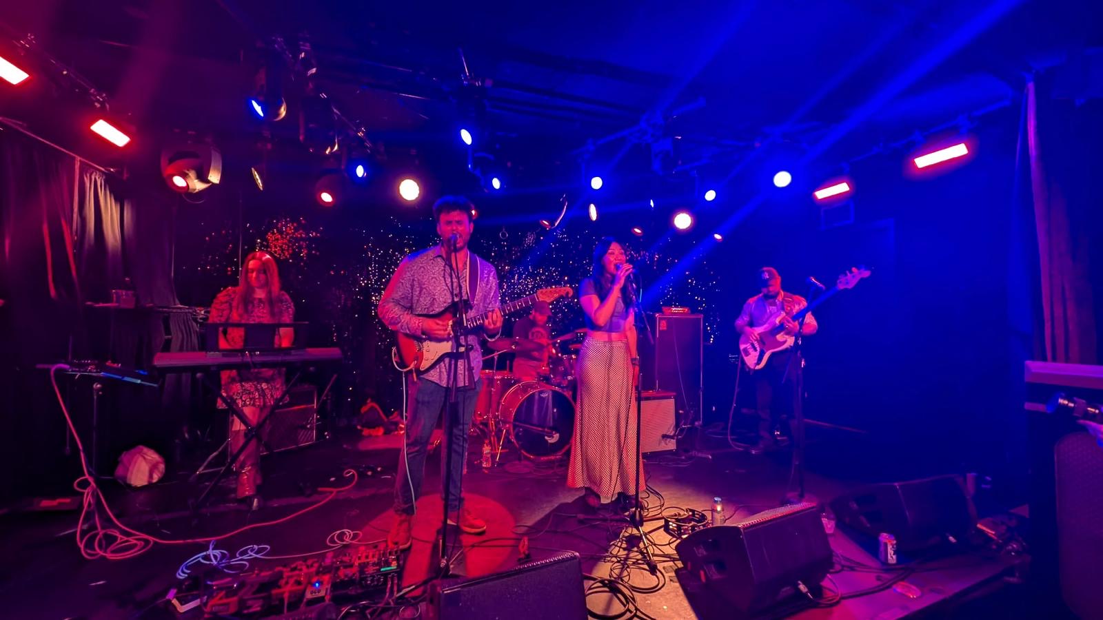 Good Time Mystery Vision performing together outdoors